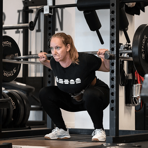 woman squatting at Gatti Training